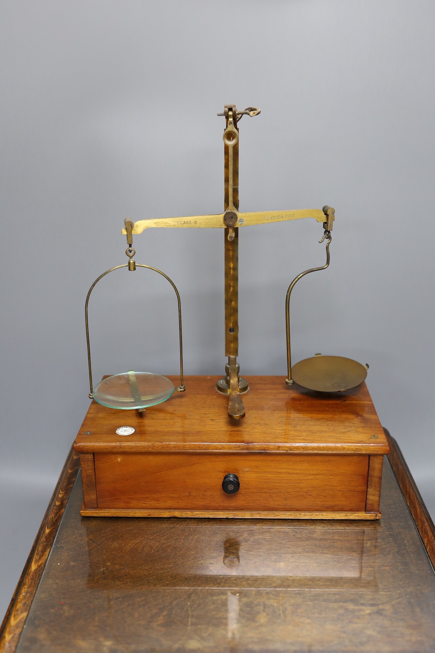 A Victorian oak instrument stand and a set of Stanley scales with weights